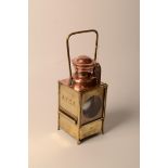 A French railway brass and copper lantern, inscribed 'S.N.C.F.', height 39cm.