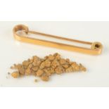 Nearly pure gold nuggets 3.6g, together with a 14ct gold pin 3.3g.
