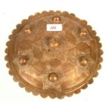 An Islamic brass shield, diameter 24.5cm.