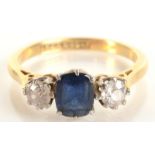 An 18ct gold sapphire and diamond three stone ring.