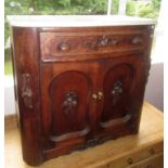 A continental oak marble topped side cabinet, early 20th century,