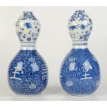 A pair of Chinese blue and white porcelain double gourd vases, 20th century, height 25cm.