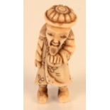 Stag horn netsuke carved as a man, height 5.9cm.