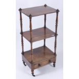 A Victorian rosewood three tier whatnot, with turned supports above a single drawer and turned,