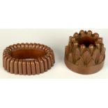 A Victorian copper jelly mould, height 11.5cm, diameter 15.5cm and another height 6cm, length 20.