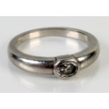 A heavy platinum ring set with a single oval diamond, 6.95g, size N.
