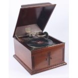 A mahogany table gramophone, His Masters Voice, with a pair of doors, height 30cm, width 37cm,