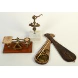 A set of postage scales and two others.