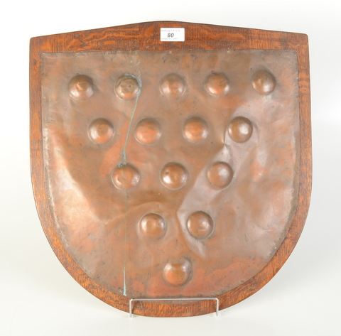 A copper Cornish arms plaque, mounted on an oak shield, height 48cm, width 45.5cm.