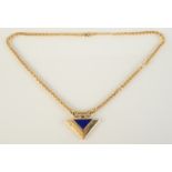 A 14ct gold triangular pendant set with a lapis panel and four diamonds, on 14ct gold chain, 14.5g.