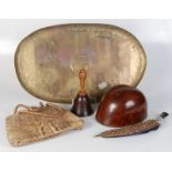 An Arts and Crafts brass tray, 59 x 35cm, a crocodile skin handbag, a treen bell,