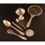 A silver cup, a silver mounted hand mirror together with other silver.