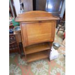 An oak Arts and Crafts bureau, height 124cm, width 76.5cm.