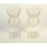 A pair of cut glass wine glasses, decorated with thistles, height 18.5cm.