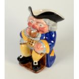 A Clarice Cliff Newport Pottery toby jug, in the form of a seated man drinking a jug of ale,