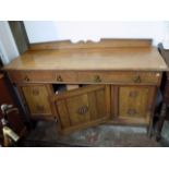 An Arts and Crafts oak sideboard, each drawer stamped 'J.B.