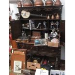 An oak dresser, 20th century, the rack with two cupboard doors and shelves,