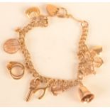 A 9ct. gold charm bracelet, 15.6g.