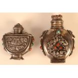 Two Chinese white metal snuff bottles.