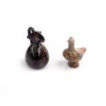 A glazed pottery bird whistle, 19th century, height 8.5cm, length 9cm and a jug, height 9.5cm.