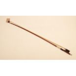 A violin bow, copy of an Adam, impressed 'JEAN DOM.ADAM, length 73.5cm.