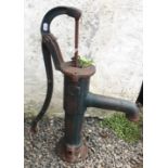 A green painted cast iron garden pump, height 67cm.