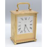 A Jaeger Le Coultre brass mantel clock, the rectangular silvered dial with arabic numerals,