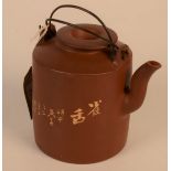 A Chinese Yixing teapot, the body with a crane amongst foliage, calligraphy and seal mark to base,