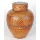 A straw work jar and cover, late 19th century, height 28cm, diameter 20cm.