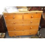 A pine chest of drawers, with two short and three long drawers on bun feet, height 97cm,