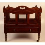 A Victorian mahogany four division Canterbury, with a single drawer on turned tapering legs,