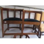 A set of three Arts and Crafts oak tub armchairs,