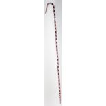 A Nailsea glass walking stick, with red spiral decoration, length 96cm.