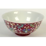 A Chinese porcelain bowl of rounded form with everted rim,