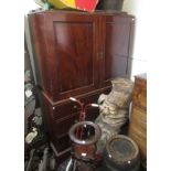 A George III mahogany linen press, the dentil cornice above a pair of panelled doors,