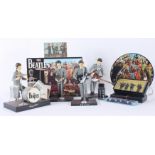 A collection of Beatles memorabilia to include four figures by Hamilton Gifts Ltd,