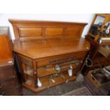 An oak buffet, early 20th century, the solid gallery back with three rectangular panels,