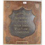 A Penzance and District Horticultural Society copper shield, mounted on an oak plaque,