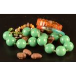 A jade and agate bangle etc.