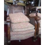 An Art Deco walnut three piece bergere suite,