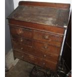 A Victorian pine desk with hinged sloping top over two short and three long drawers, width 104cm,