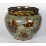 A Royal Doulton stoneware jardiniere, decorated with leaves, the base impressed 2109 and 694,