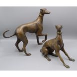 Two bronze models of greyhounds, one height 32cm, width 33cm, the other height 25cm, width 29cm.