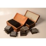 Two boxes of glass photographic negatives,
