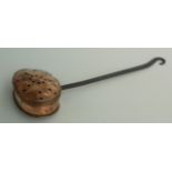 A Victorian copper chestnut roaster, with black painted steel handle and hinged pierced cover,