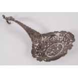 An ornate Dutch silver straining spoon.