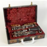 A Boosey & Hawkes Regent wooden clarinet No.127450, in fitted case.