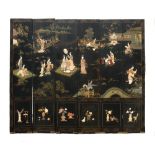A Chinese six fold black lacquered wood floor screen decorated in gold lacquer and hard stones