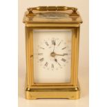 A French alarm carriage clock with brass case.