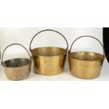 Three 19th century brass preserve pans.
